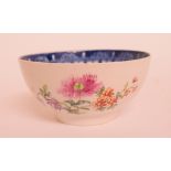 A late 18th century Lowestoft porcelain bowl, decorated flowers in enamel, restored,