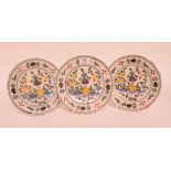 A set of three 19th century Dutch delft polychrome plates,