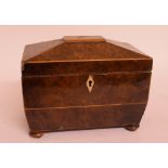 A 19th century yew wood tea caddy, of sarcophagus form, lacks interior,