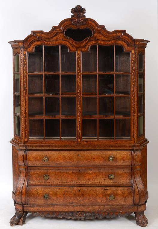 A Dutch walnut bombe cabinet on chest, inlaid with beasts, scrolling acanthus leaves,