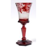 A late 19th century Bohemian ruby glass goblet, decorated two stags and a hind,