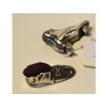 A novelty silver roller skate pincushion,