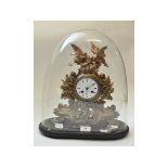 A 19th century French gilt metal mantel clock, surmounted birds and chicks in a nest,