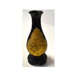 A lacquer vase, with gilt decoration,