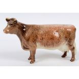 A Beswick Dairy Shorthorn Cow, 1510, small chip front left hoof,