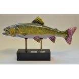 A pottery fish, on a stand,