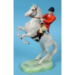 A Beswick Huntsman, rearing, style 2, painted white, 868, one of horse's ears restored,