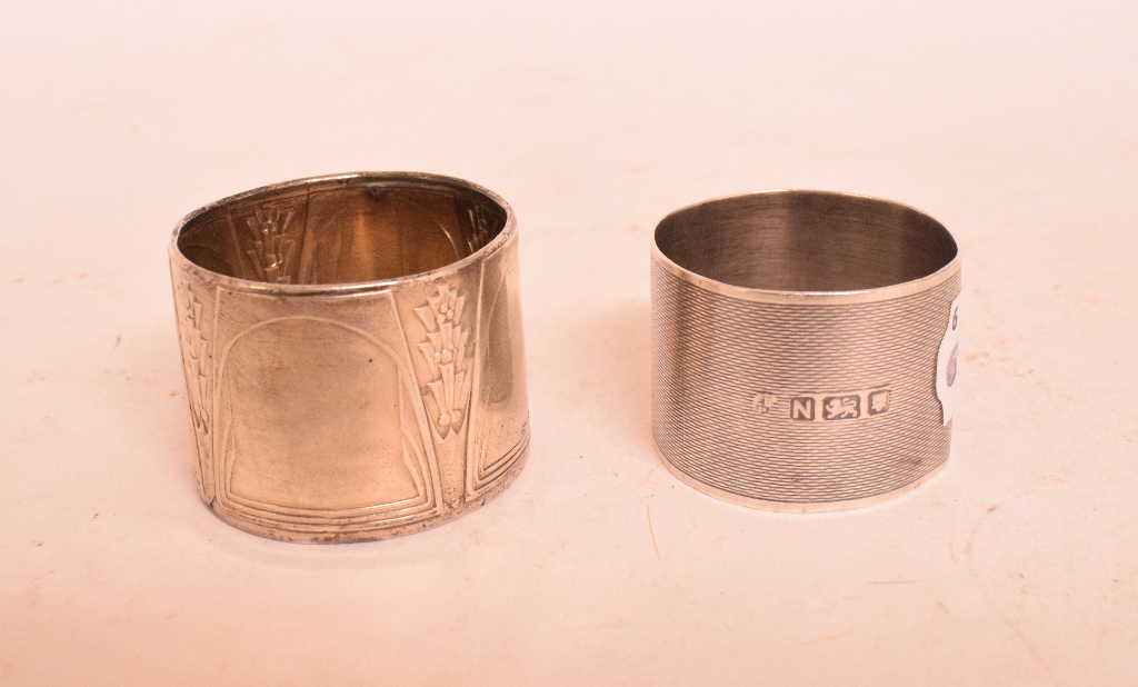 Two silver napkin rings, assorted silver spoons, approx. 10.
