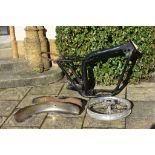 A Triumph Tiger 750V frame, with a front wheel,