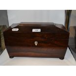 A 19th century rosewood tea caddy, of sarcophagus form, 31 cm wide,