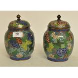 A pair of cloisonné vases and covers, decorated flowers, 19.