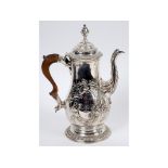 An early George III plated on copper baluster coffee pot, crested, and engraved foliage and flowers,