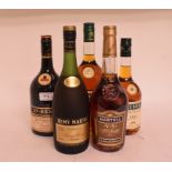 A bottle of Remy Martin VSOP cognac, a bottle of St Remy VSOP cognac, a bottle of Martell VS cognac,