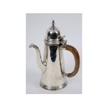 An early 18th century style silver chocolate pot, of cylindrical tapering form, London 1964, approx.