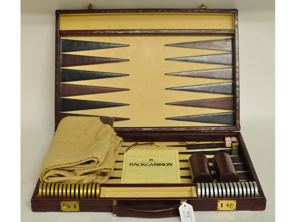 An Etienne Aigner leather backgammon set,