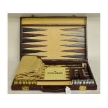 An Etienne Aigner leather backgammon set,