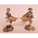 A pair of plated metal figural table salts, in the form of a girl and a boy,