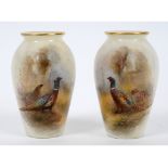 A pair of Royal Worcester porcelain vases, each painted a cock and hen pheasant, signed JAS Stinton,