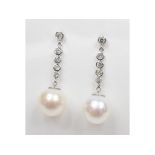 A pair of diamond and pearl drop earrings,