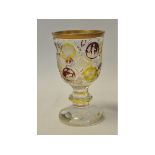 A Bohemian ruby and amber cut and flashed glass goblet, with gilt rim,