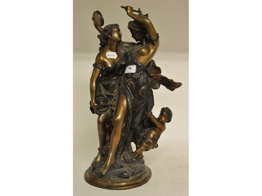 A Continental cast metal group, in the form of two females and a child,