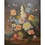 Continental school, a still life of flowers in a glass vase, oil on board, indistinctly signed,