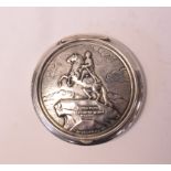 A Russian silver coloured metal compact, decorated The Bronze Horseman Monument,