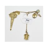 A gilt metal chatelaine, fitted a scissor box with scissors, two lockets,