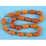 A single strand of large amber type beads See illustration Condition report Report