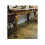 An 18th century style walnut serving table, the shaped front having a frieze drawer,