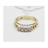A 14ct gold and four stone diamond ring, approx.