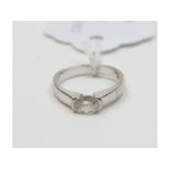 An 18ct white gold and solitaire diamond ring, set a single oval cut diamond, approx.