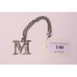 A George IV silver decanter label, M, with Bacchus masks and floral decoration, Joseph Willmore,