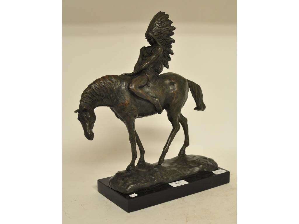 A bronzed group, in the form of an Native American on horseback, on a marble plinth,