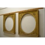 A pair of 19th century gilt gesso picture frames, with oval mounts,