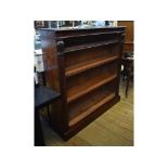 A mahogany open bookcase, with lotus leaf capped columns, on a plinth base,