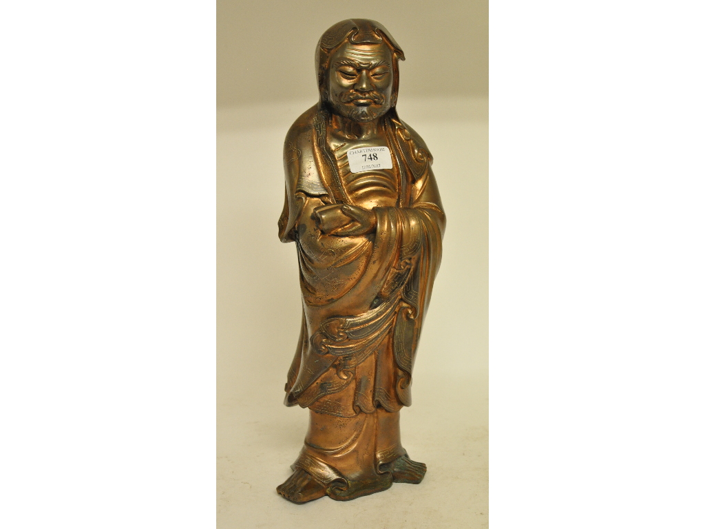 An Eastern bronze figure, in the form of Bodhidharma,