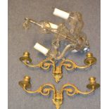 A pair of 19th century style brass two light candle wall sconces, a glass three light chandelier,