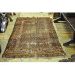 An Eastern rug, decorated geometric motifs on a black ground, within a multi border, 218 x 129 cm,