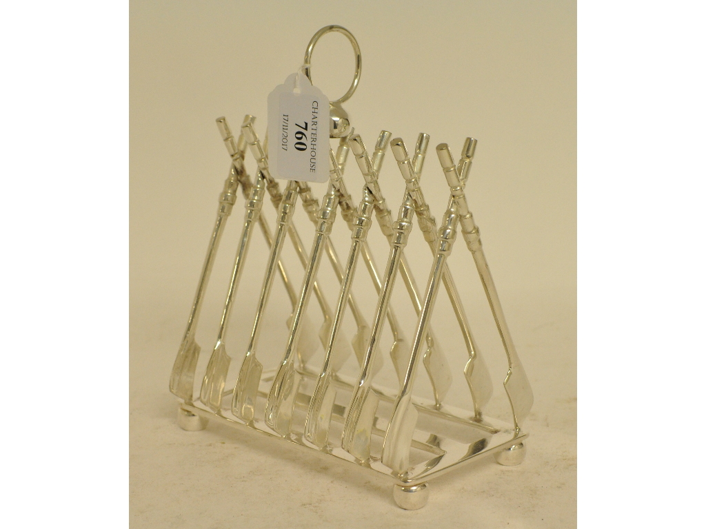 A silver plated rowing toast rack,