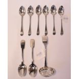 A set of six silver teaspoons, initialled, marks incomplete, a silver fiddle pattern sugar sifter,