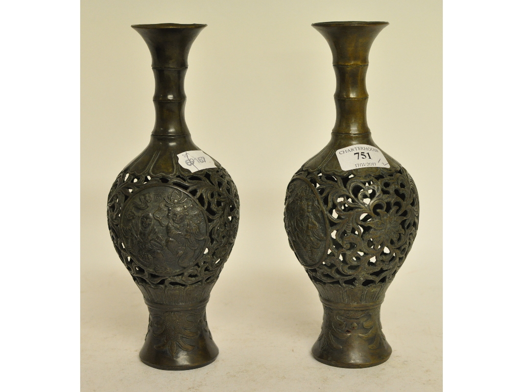 A pair of Japanese bronze vases, with pierced decoration,