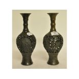 A pair of Japanese bronze vases, with pierced decoration,