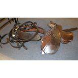 A leather horse harness, a leather saddle, junior size,