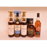 Two bottles of Macallan malt whisky, a bottle of Glenlivet Founder's Reserve whisky,