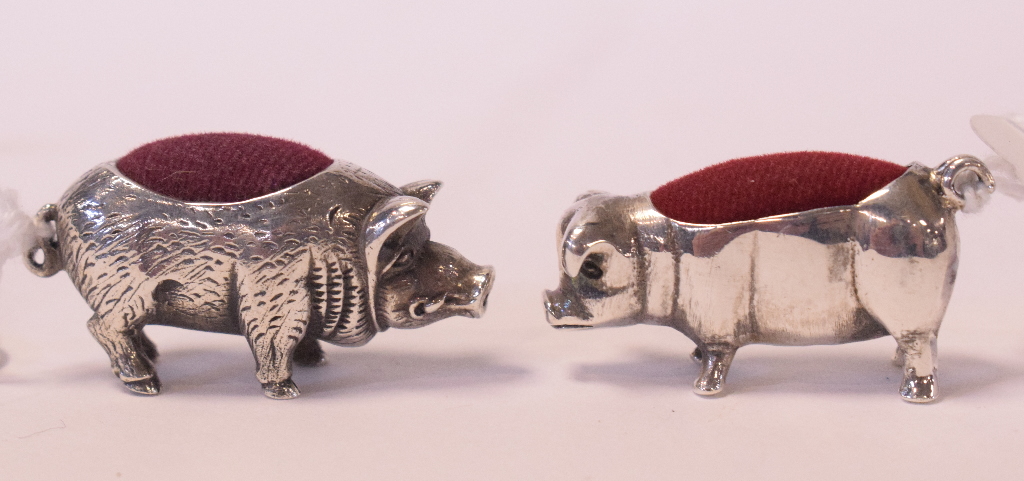 A novelty silver pincushion, in the form of a pig,