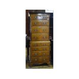 An 18th century style chest on chest, veneered in walnut, having four graduated long drawers,