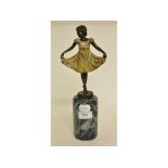 A painted metal figure of a girl in a dress, on a marble base,