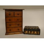 An oak table top chest on two short and three long drawers, 26 cm wide, a porcupine quill box,