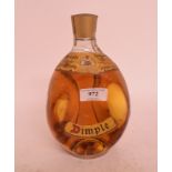 A 26 2/3 fluid ozs bottle of Dimple whisky, 70° proof,